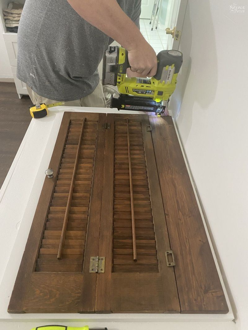 installing a repurposed plantation shutter laundry chute lid