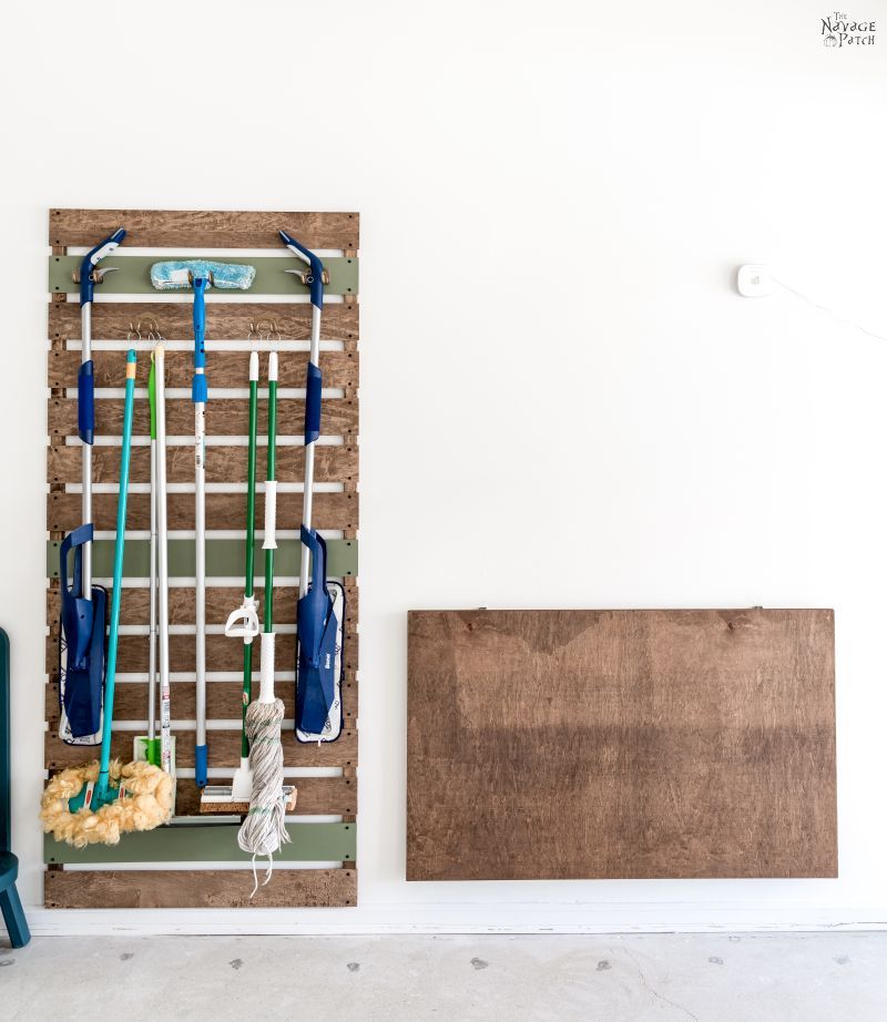 DIY folding work table and mop and broom storage rack - TheNavagePatch.com