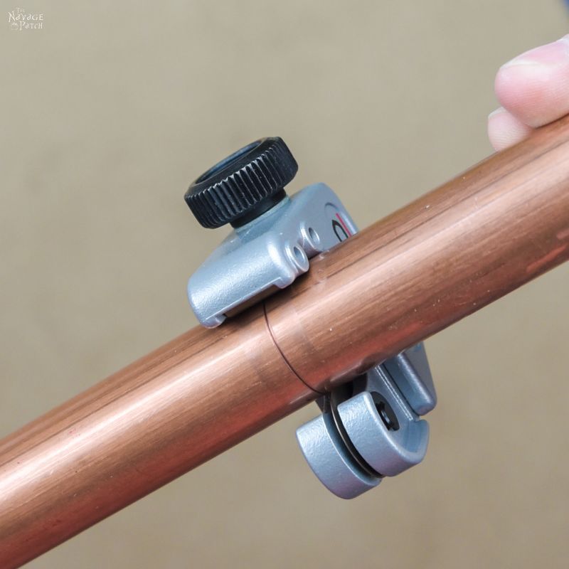 cutting a copper pipe with a tubing cutter