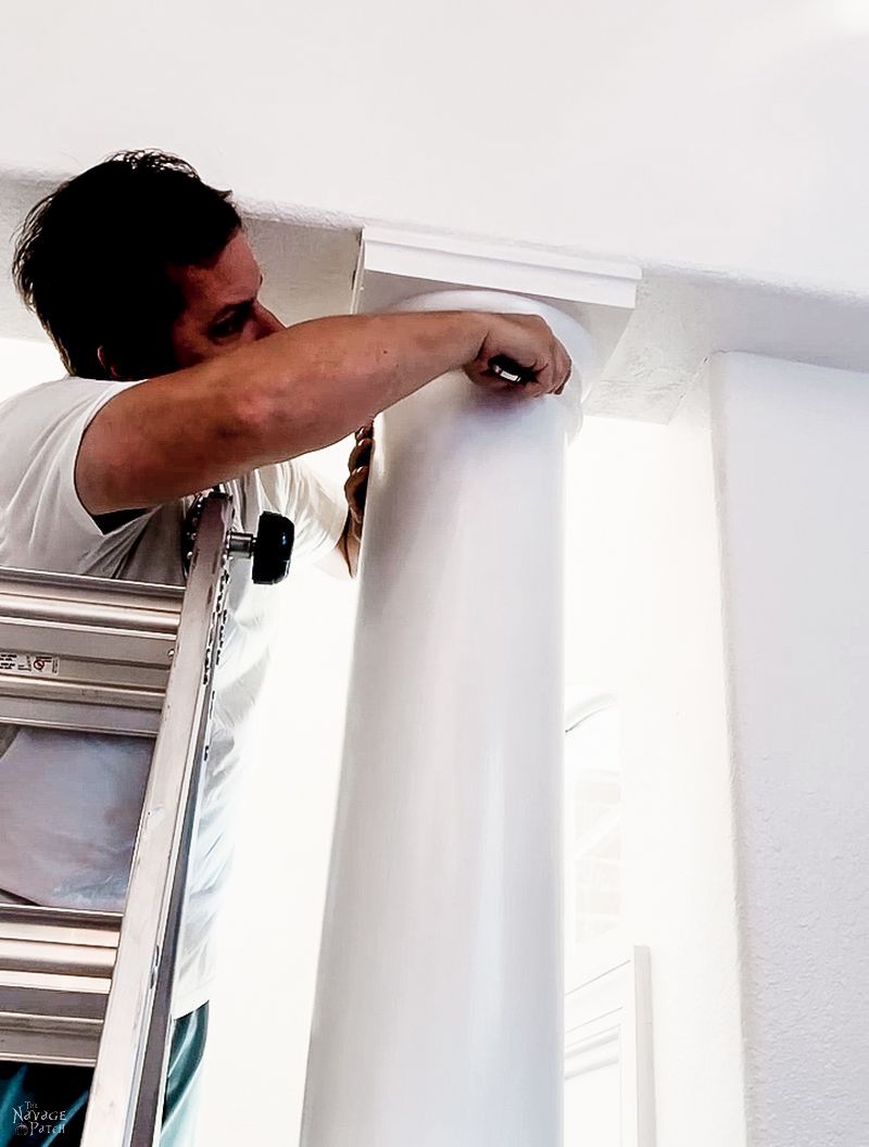 man trying to remove a column in a dining room