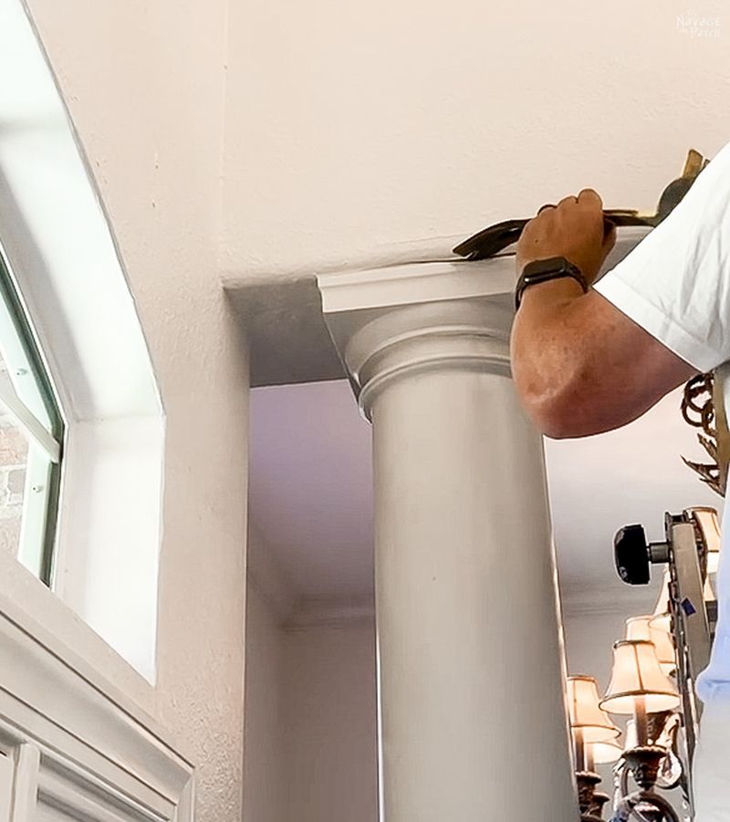 man trying to remove a column in a dining room