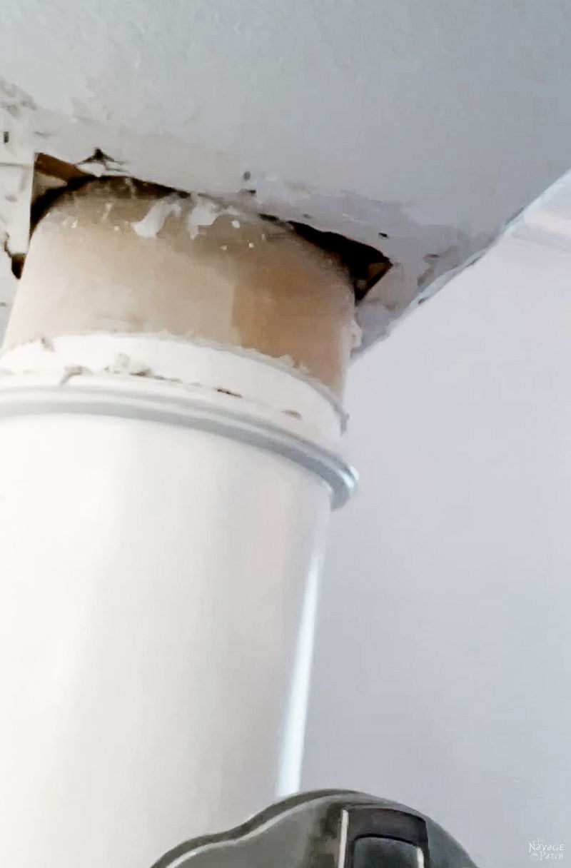 man trying to remove a column in a dining room