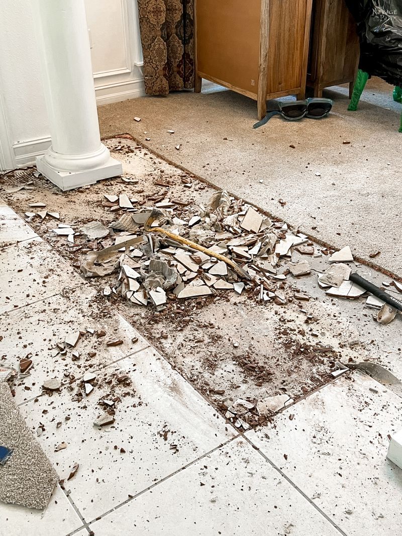 broken floor tile in a foyer