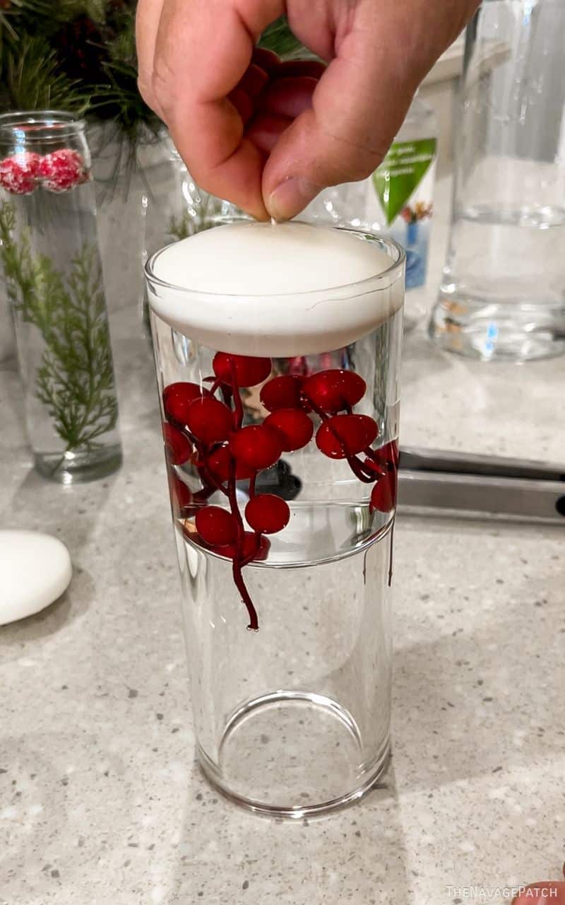 man making floating christmas candles