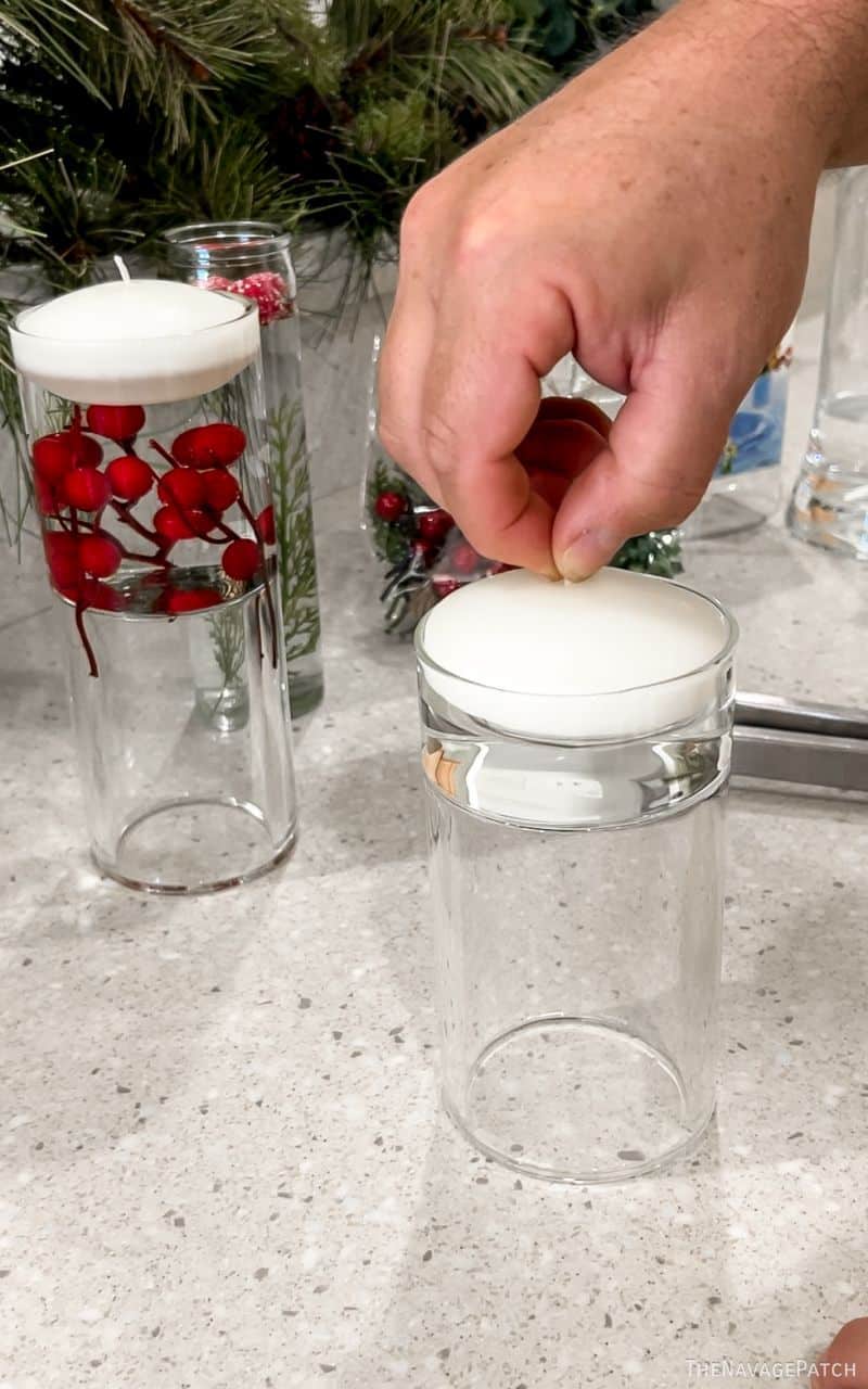 man making floating christmas candles