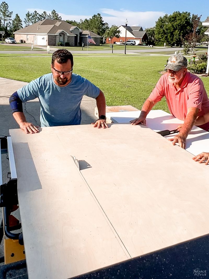 men cutting plywood