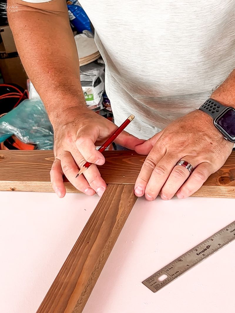 man showing how to make a sliding barn door