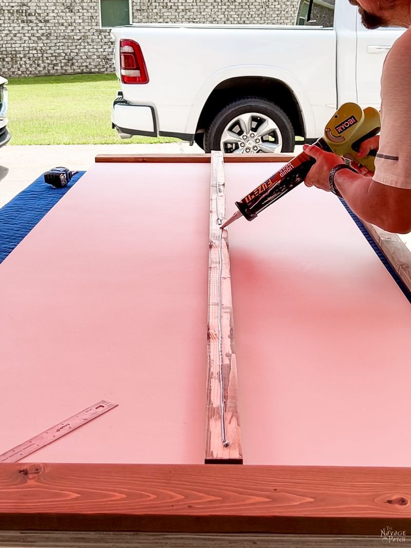 man making a modern barn door