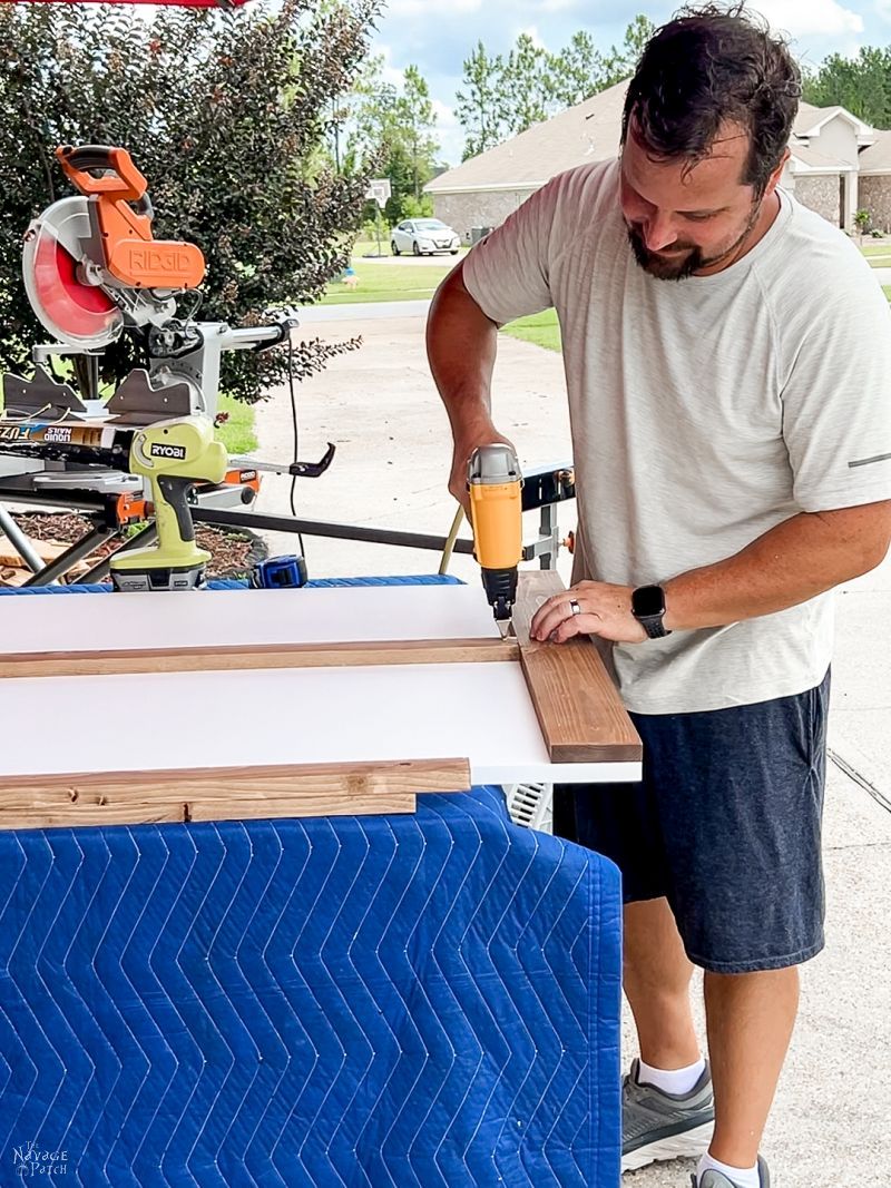 man making a sliding barn door