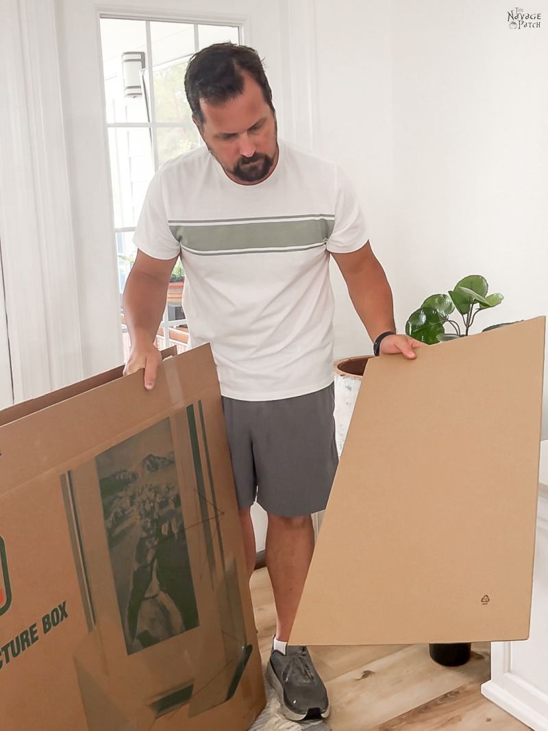 man holding boxes