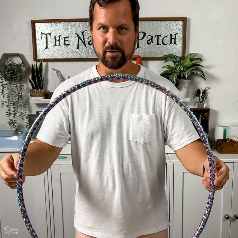 man holding a hula hoop