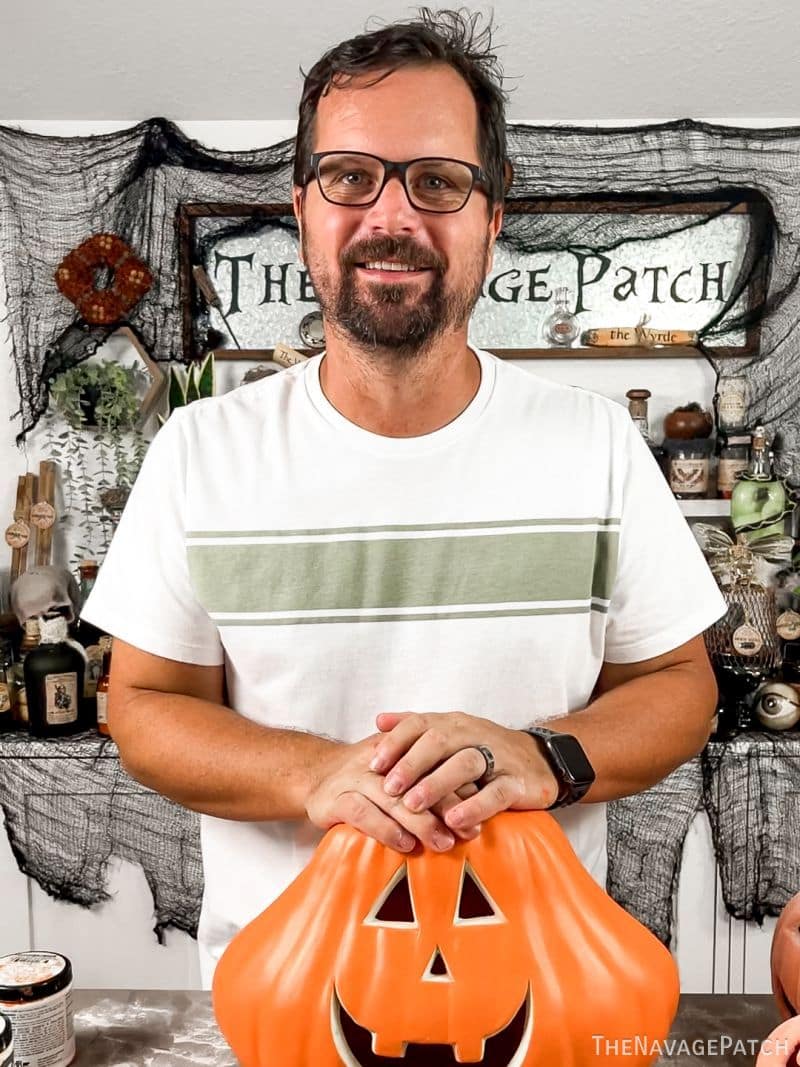 man holding plastic pumpkin