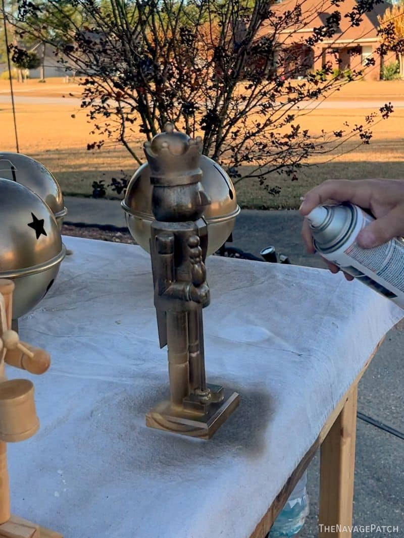 man painting nutcrackers