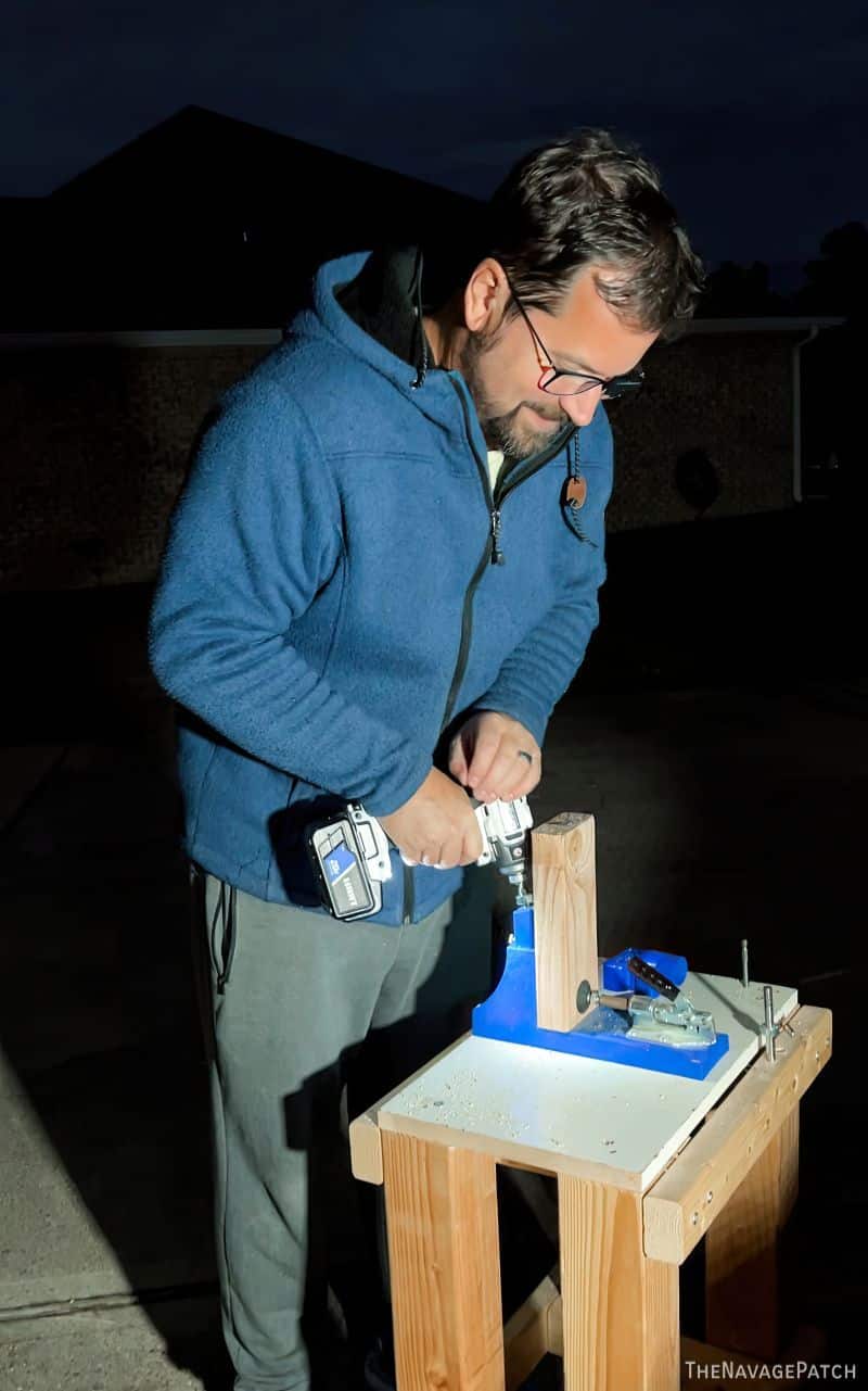 man building a cabinet base