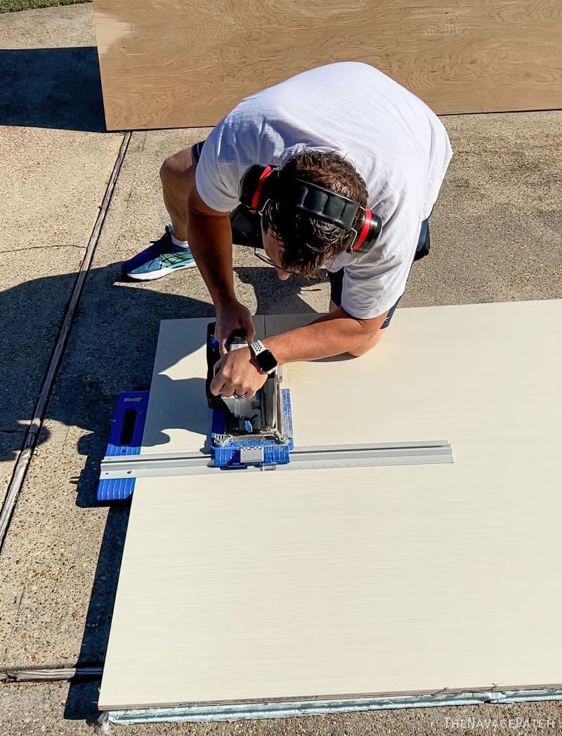 man cutting plywood