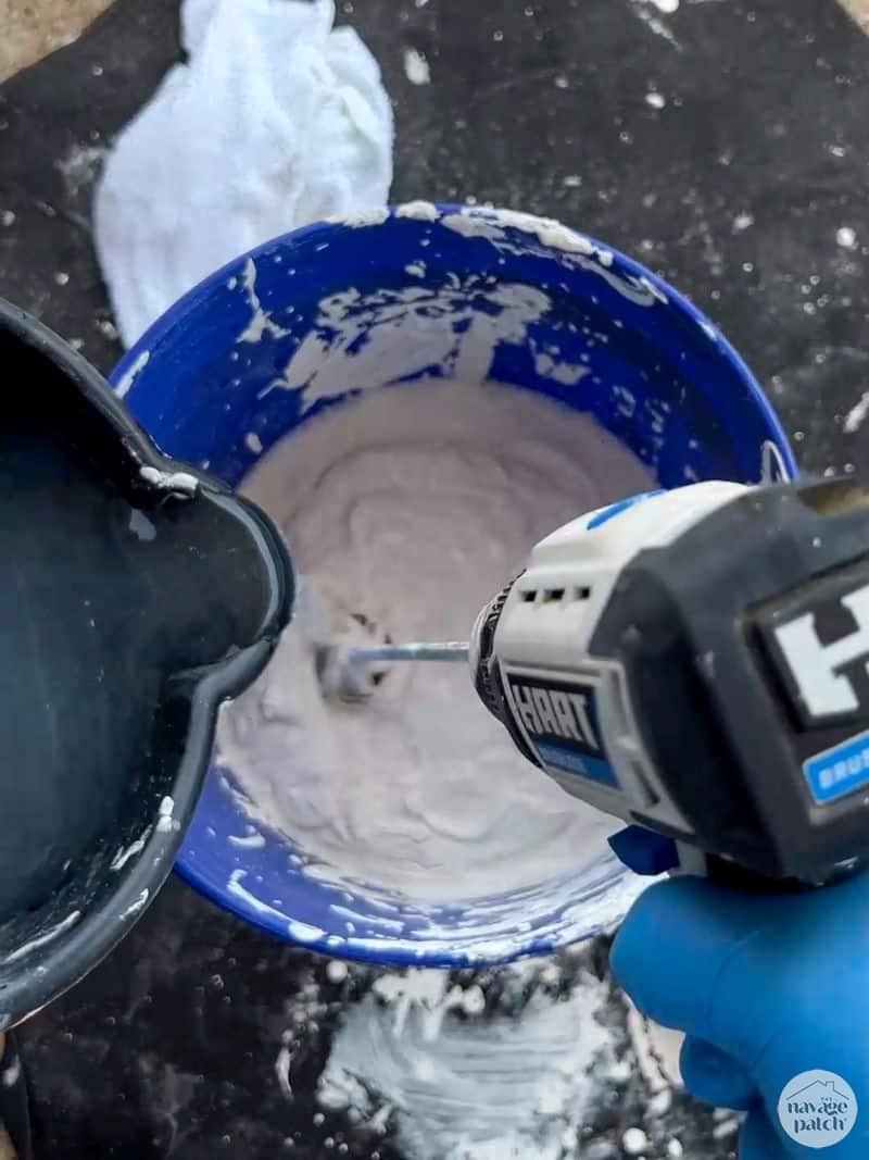 man mixing limewash paint