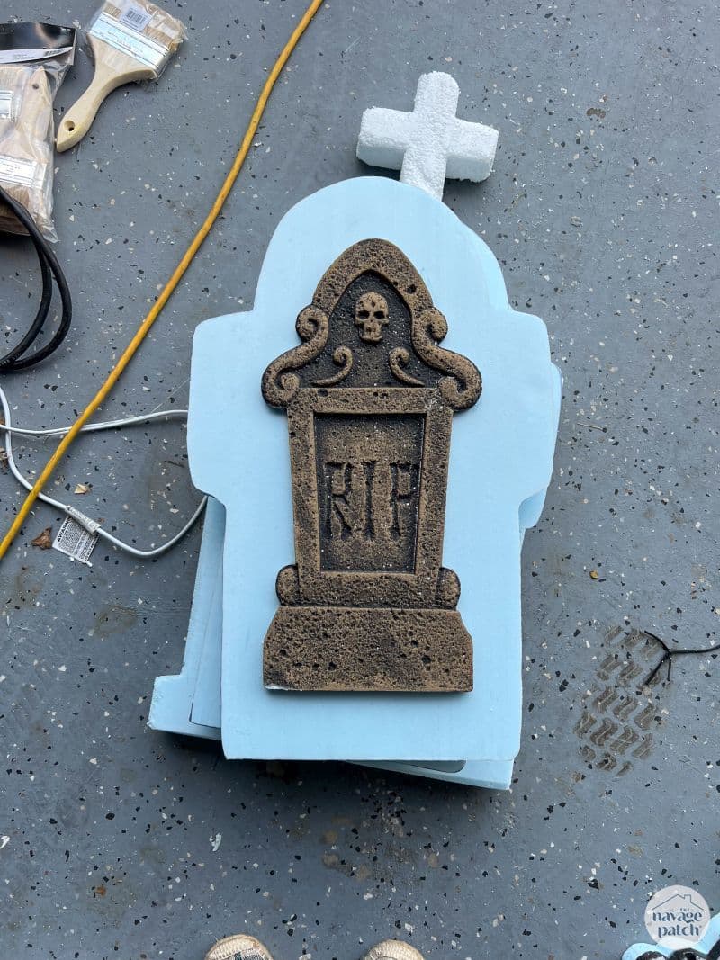 store bought foam headstone mounted on a larger piece of foam