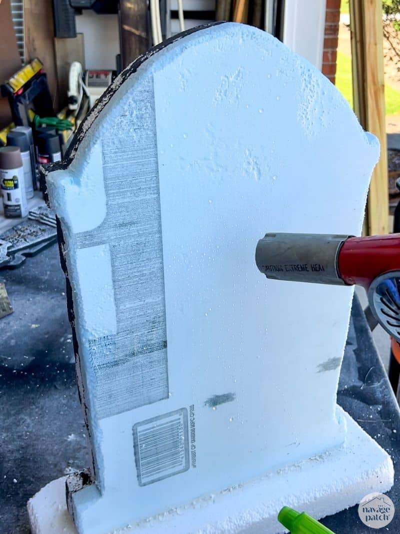 man weathering a tombstone