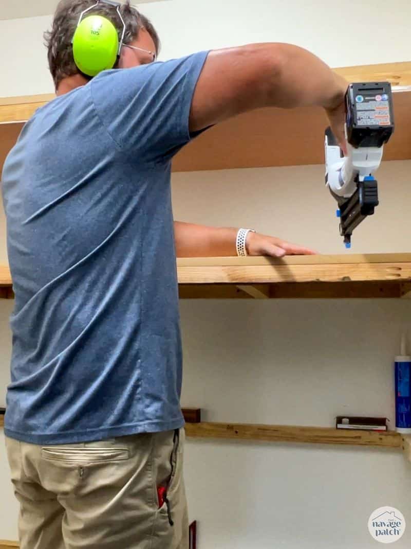 man making closet shelves