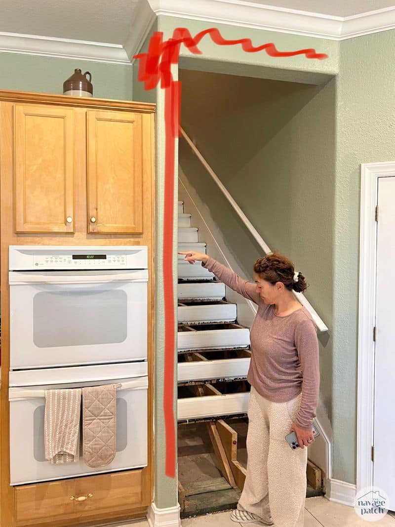 woman standing in front of staircase