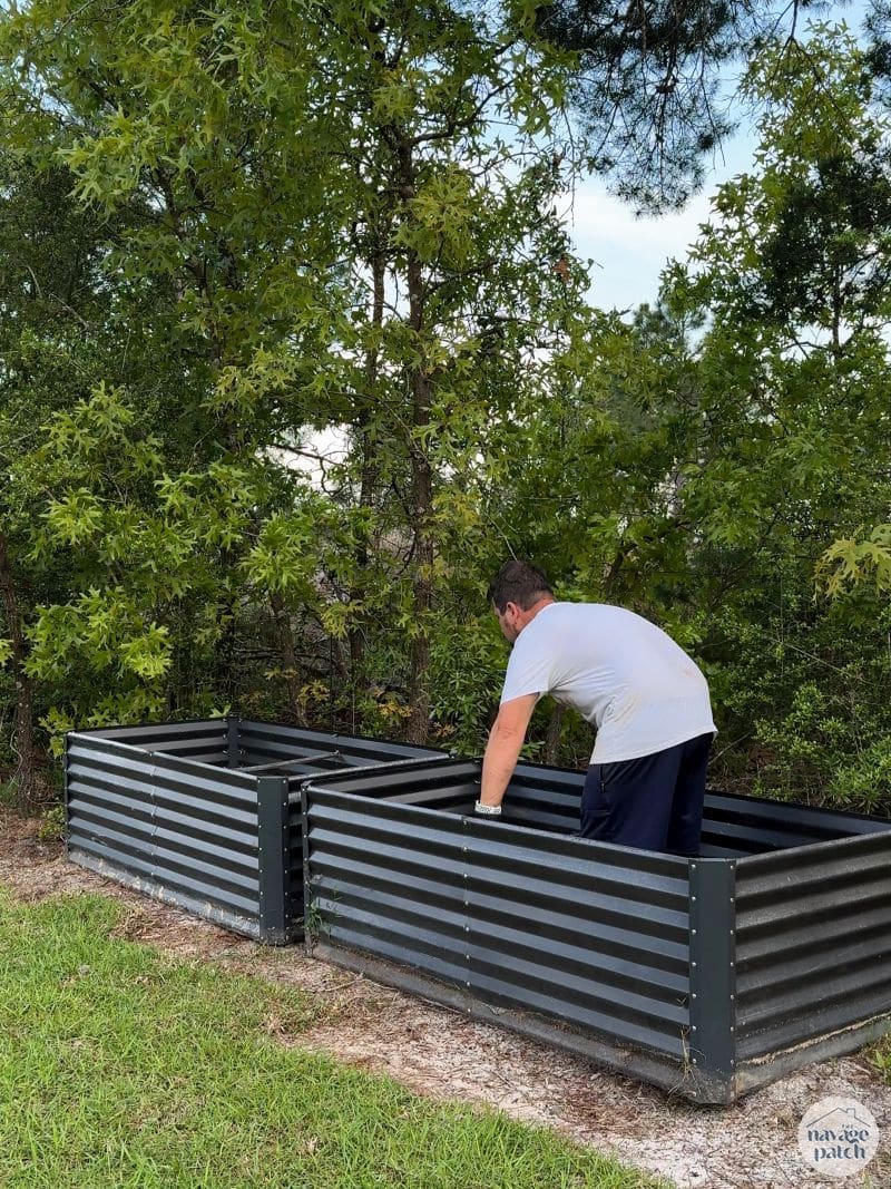 man moving a garden bed