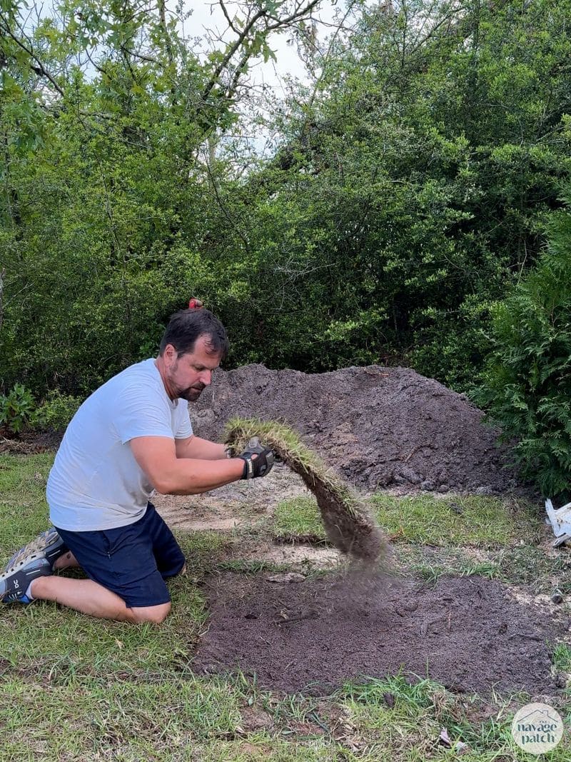 man laying sod