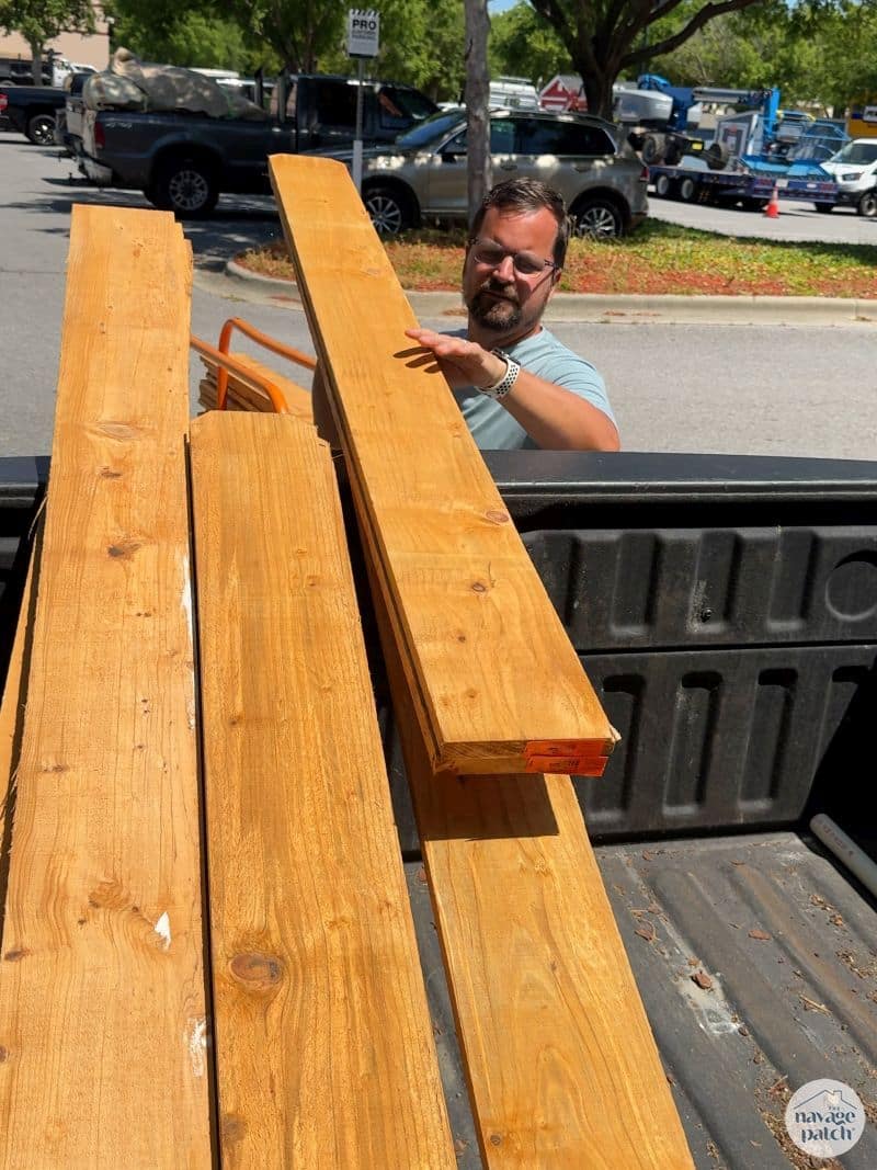 man loading wood