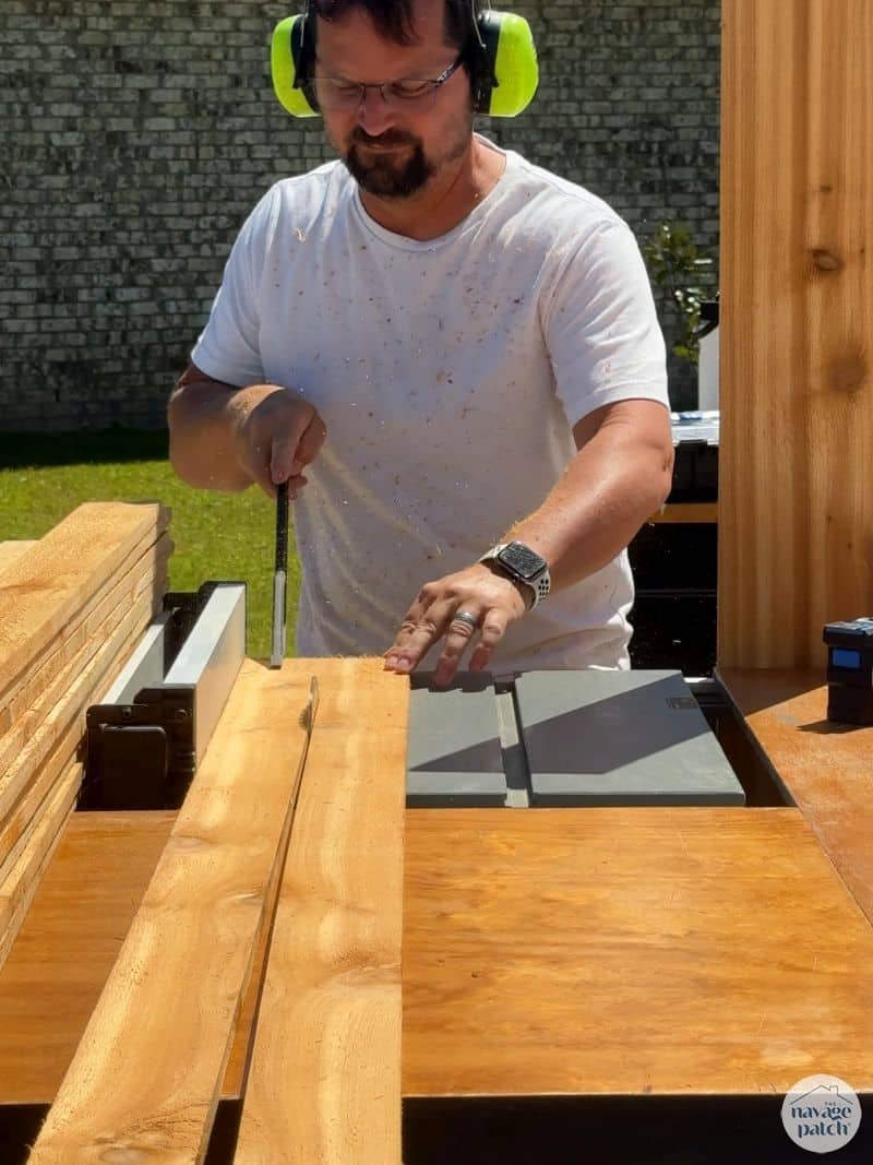 man building a raised garden bed