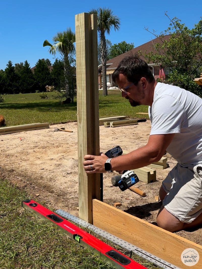 man making a raised garden bed