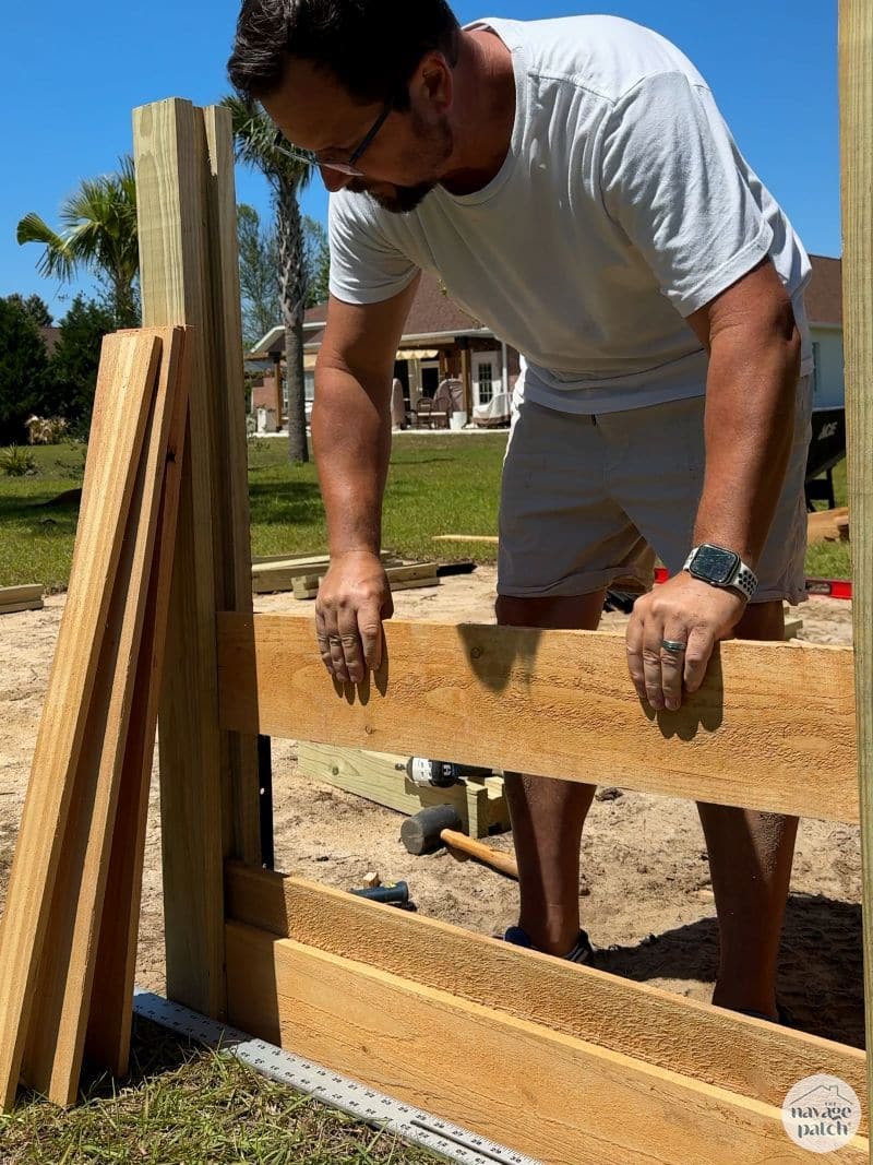 man making a raised garden bed
