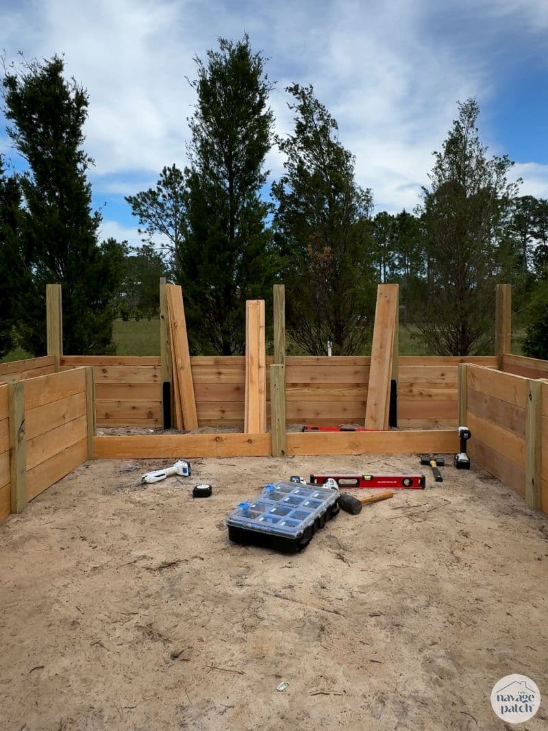 man building a diy raised garden bed