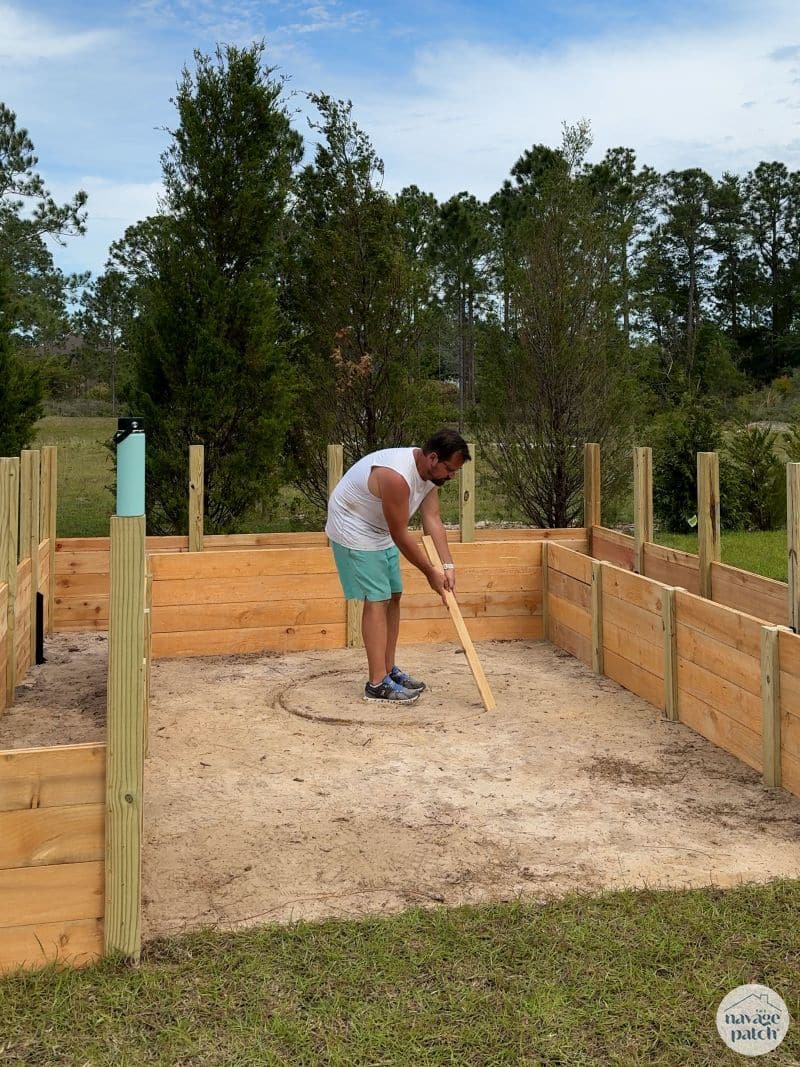 man building a diy raised garden bed
