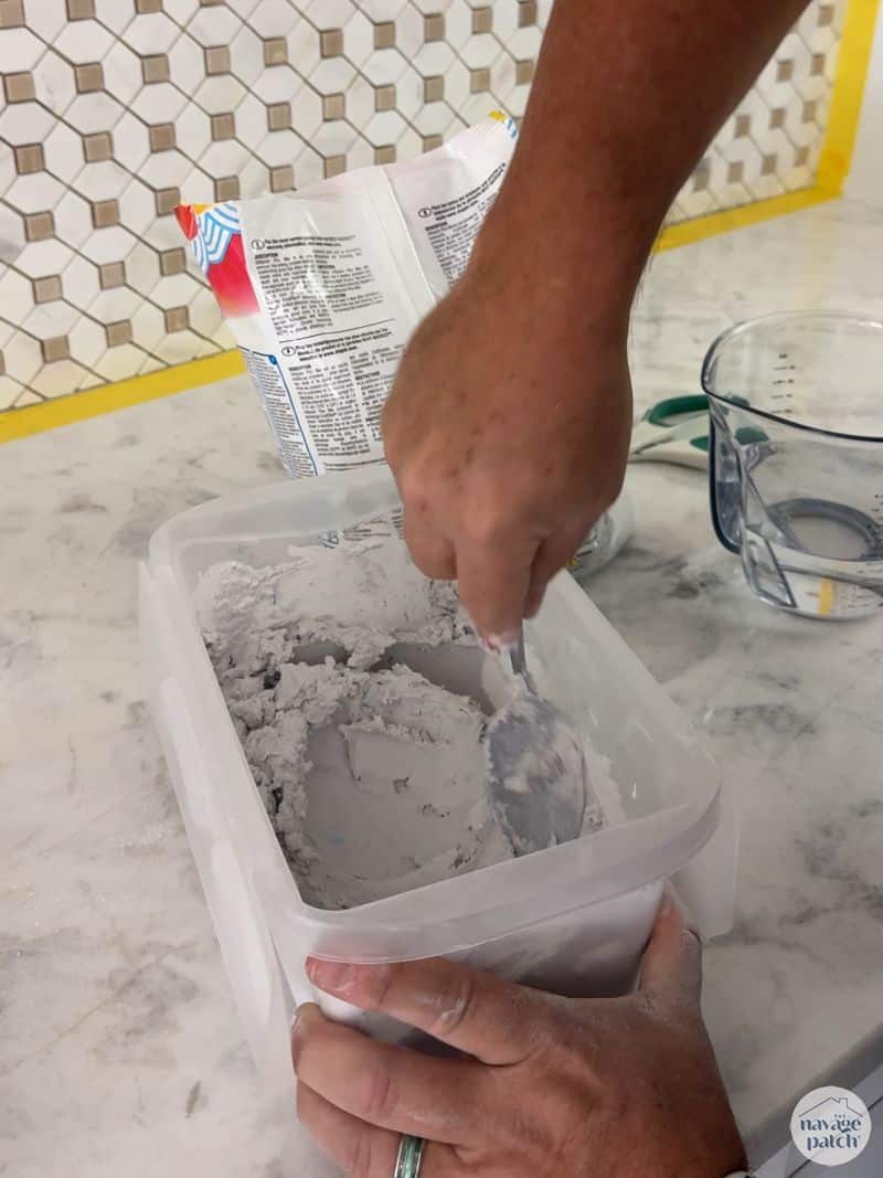 man mixing grout