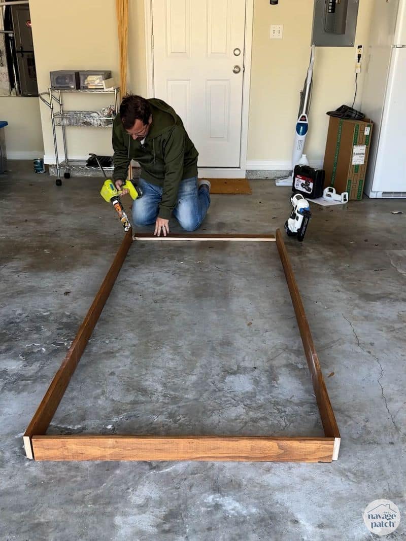 man building a plate rack