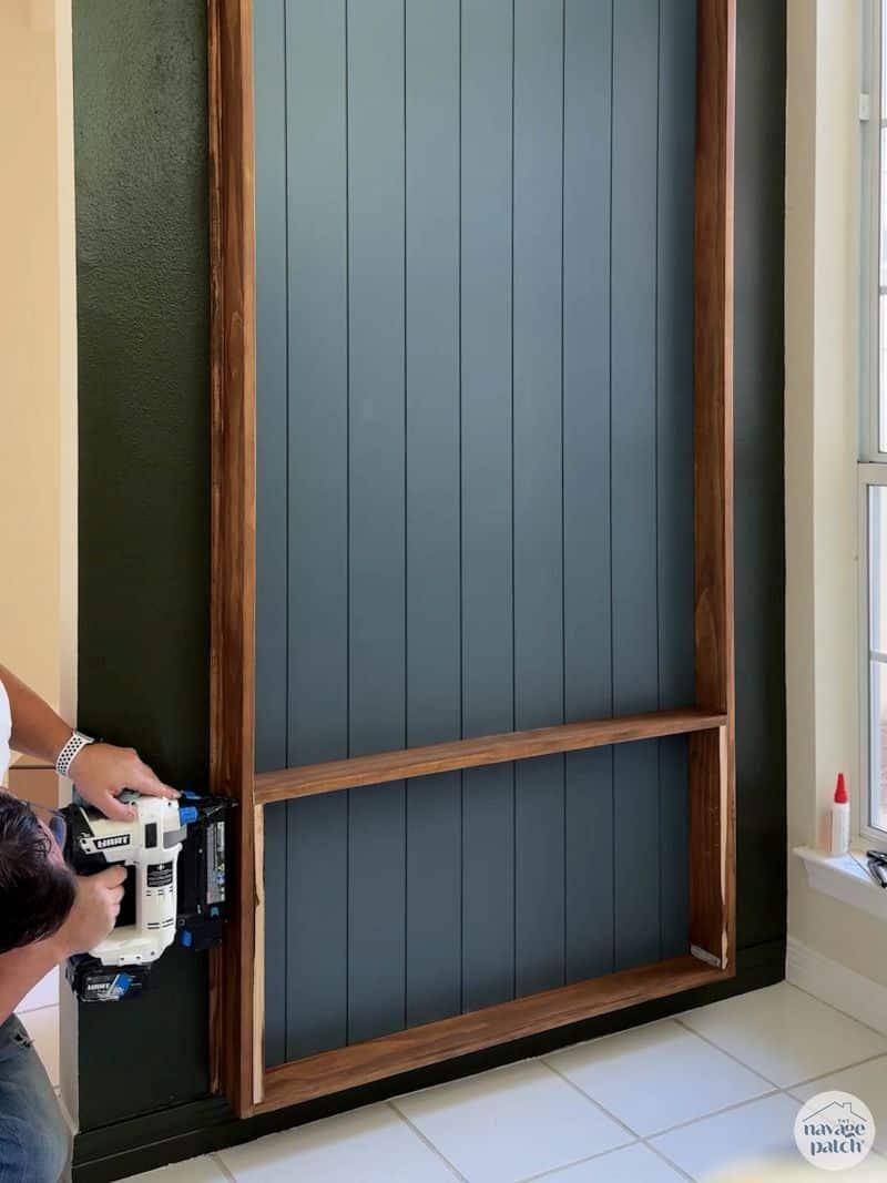 man adding shelves to a plate rack