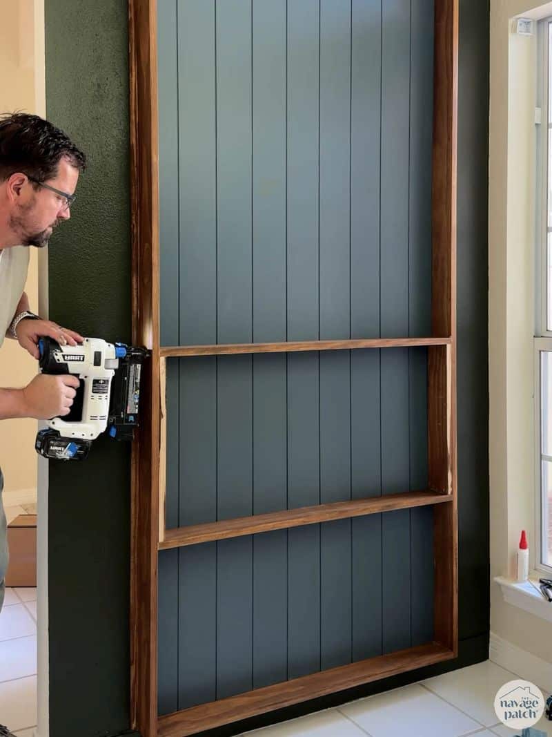 man adding shelves to a plate rack