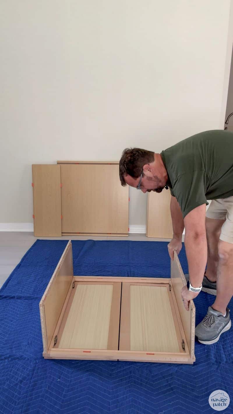man building an RTA cabinet
