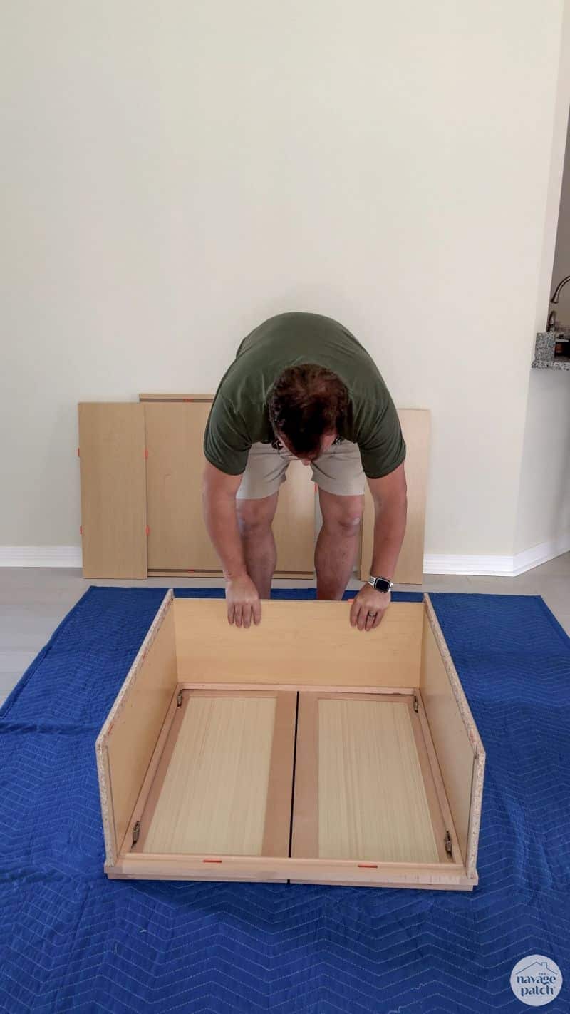 man building an RTA cabinet