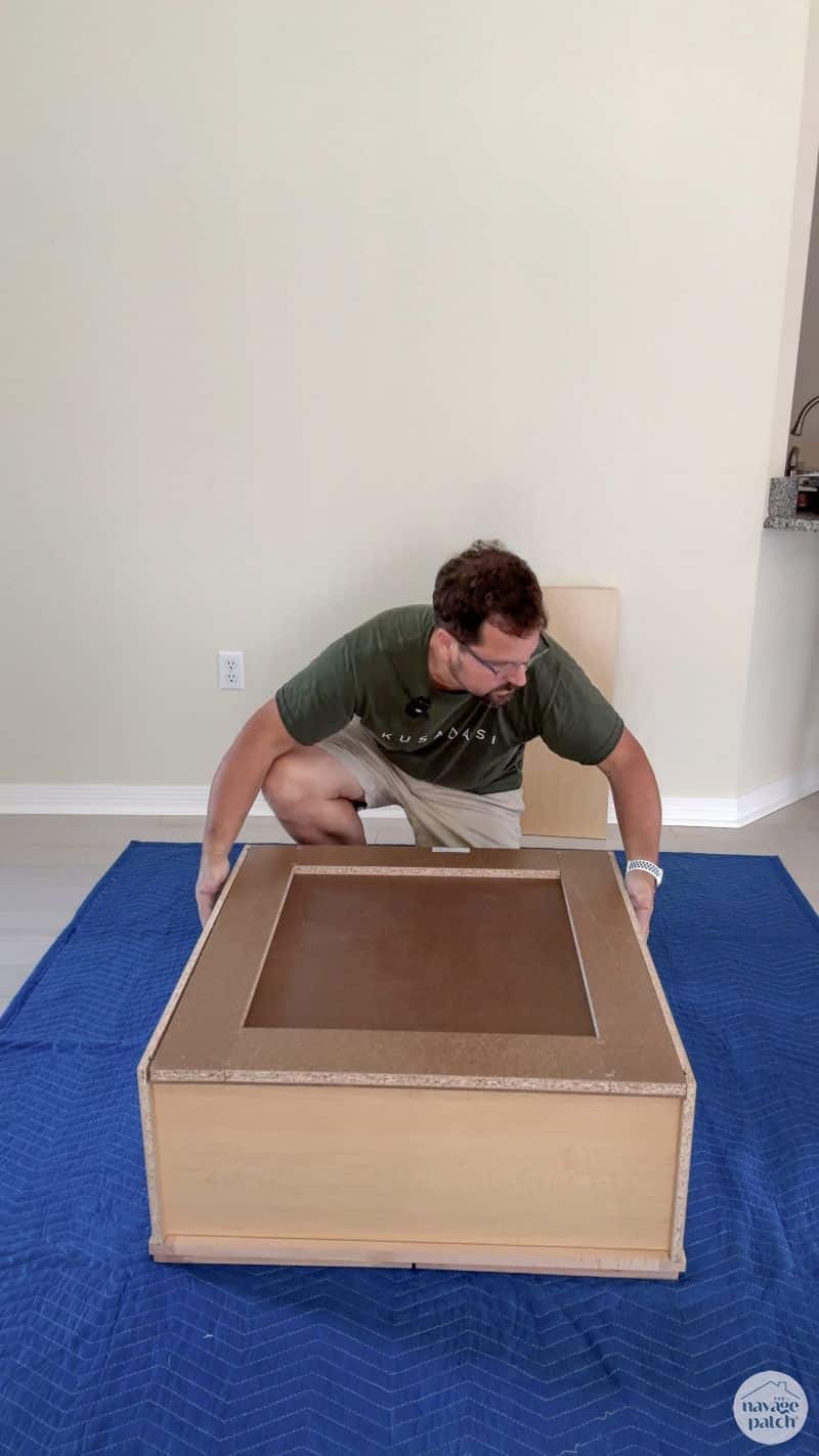 man building an RTA cabinet