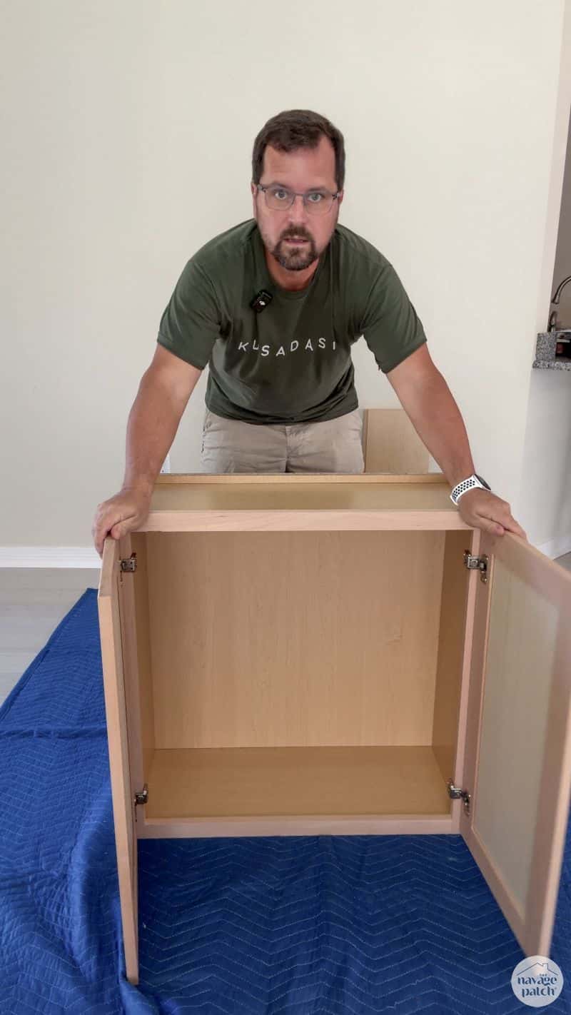 man building an RTA cabinet
