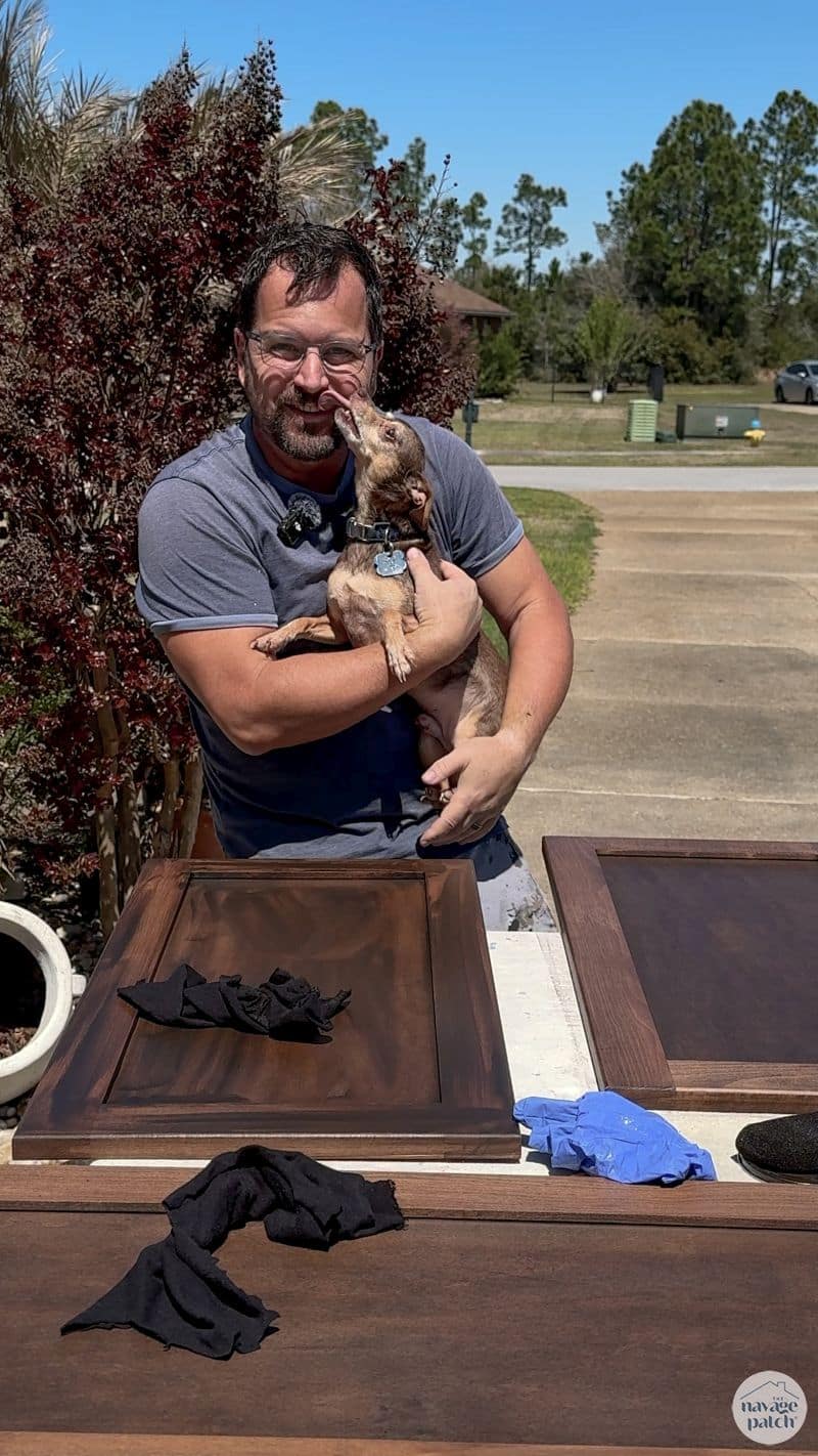 man licked by tiny dog