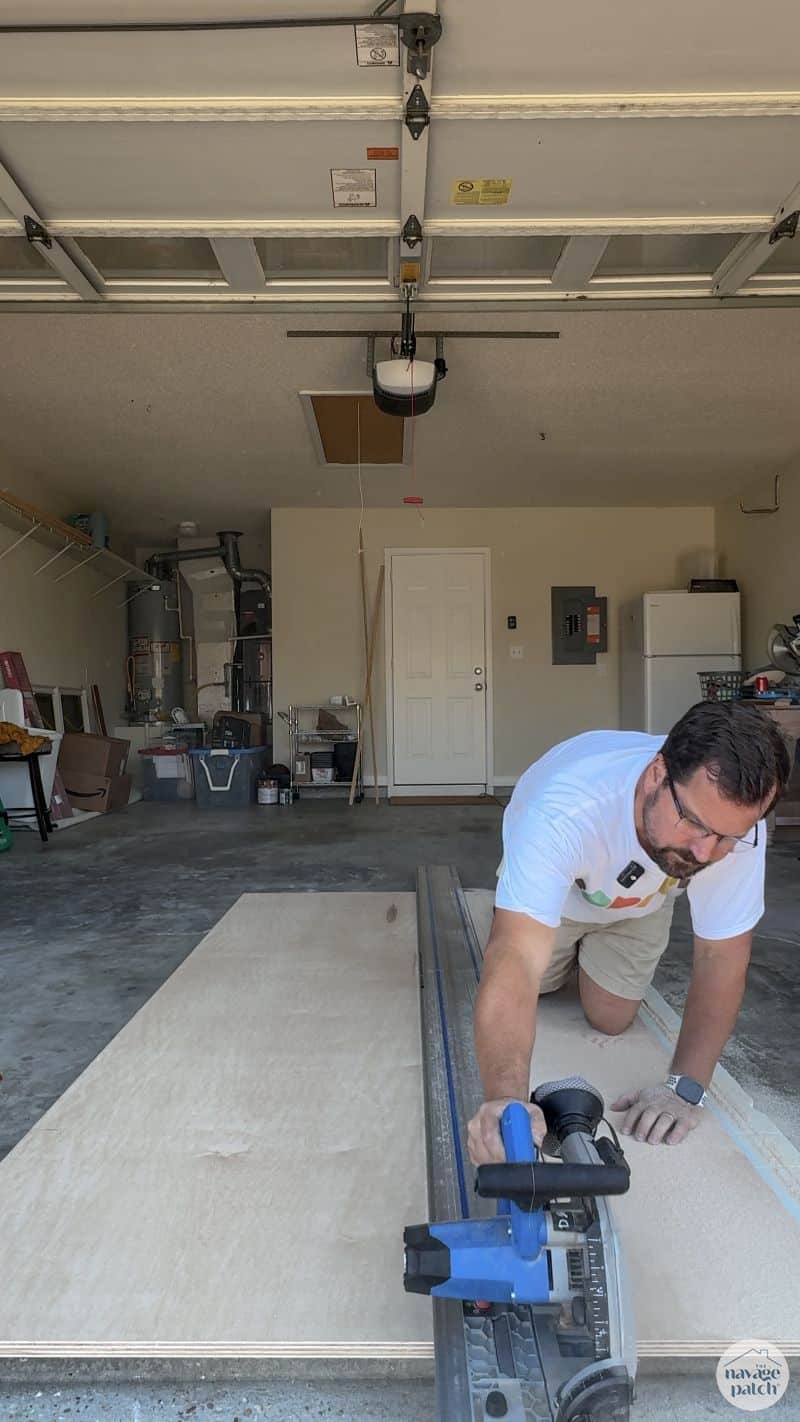 man cutting plywood