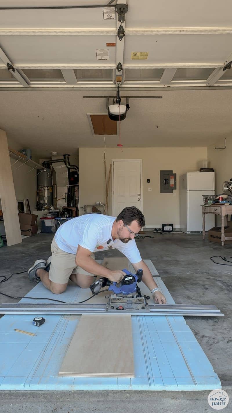 man cutting plywood
