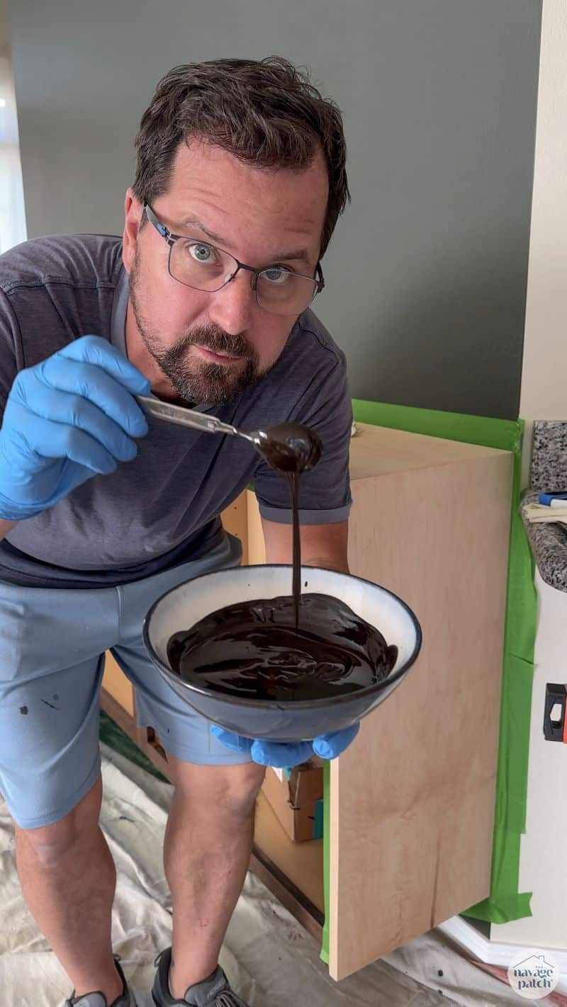 man holding a bowl of stain