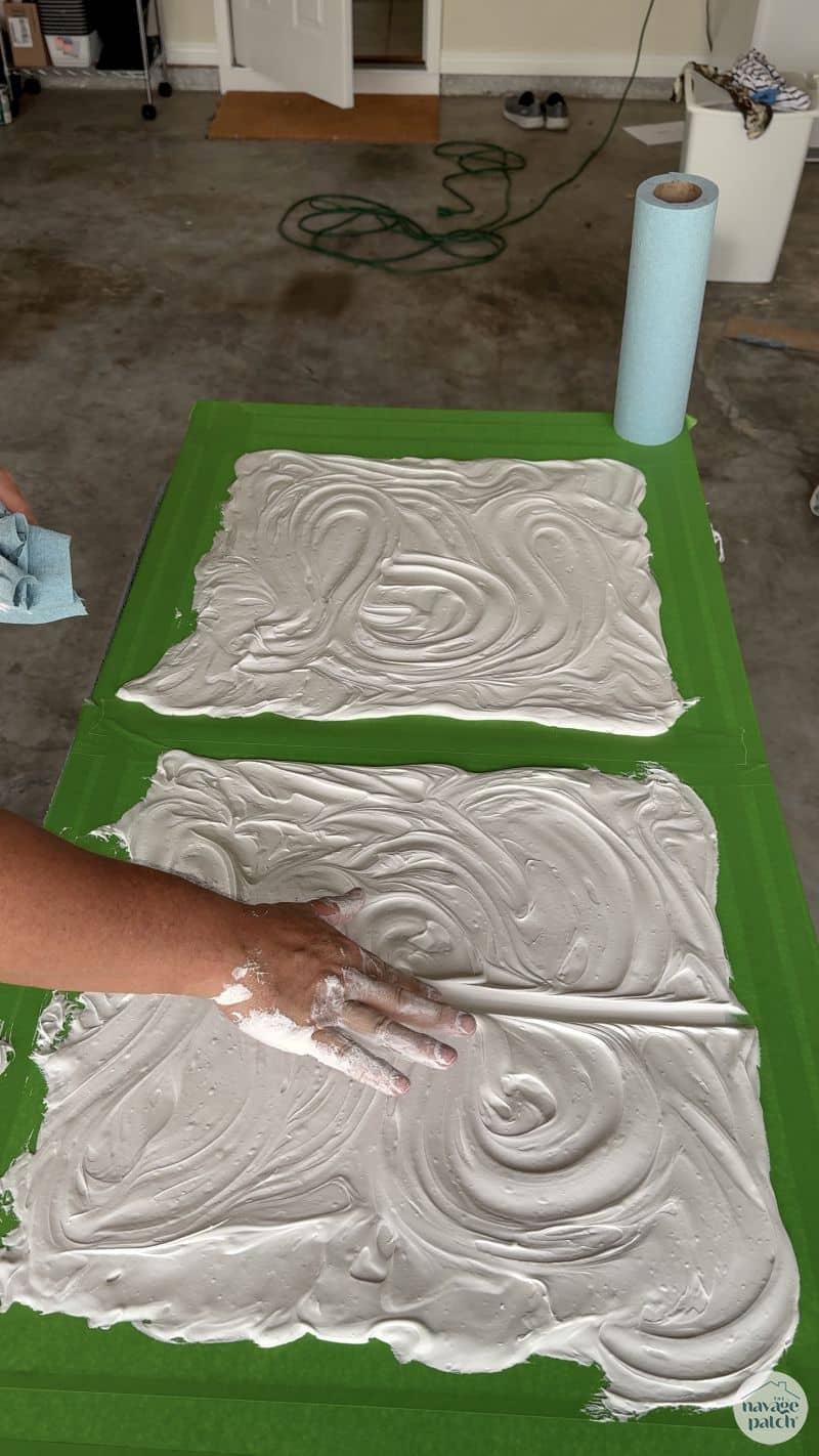 man making art with joint compound