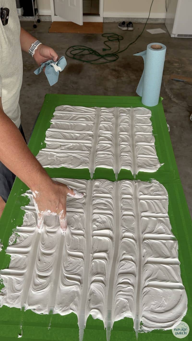 man making art with joint compound