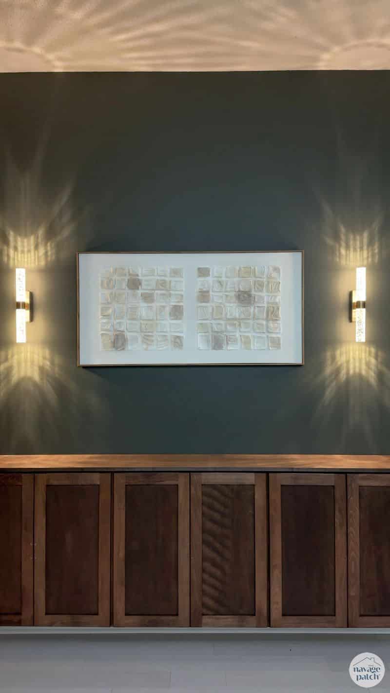 sconces and artwork above floating console